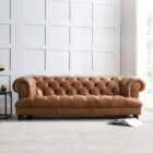 Front eye level view of the Drummond Lincoln leather sofa in a distressed brown finish featuring thick seat cushions and a traditional low profile back.